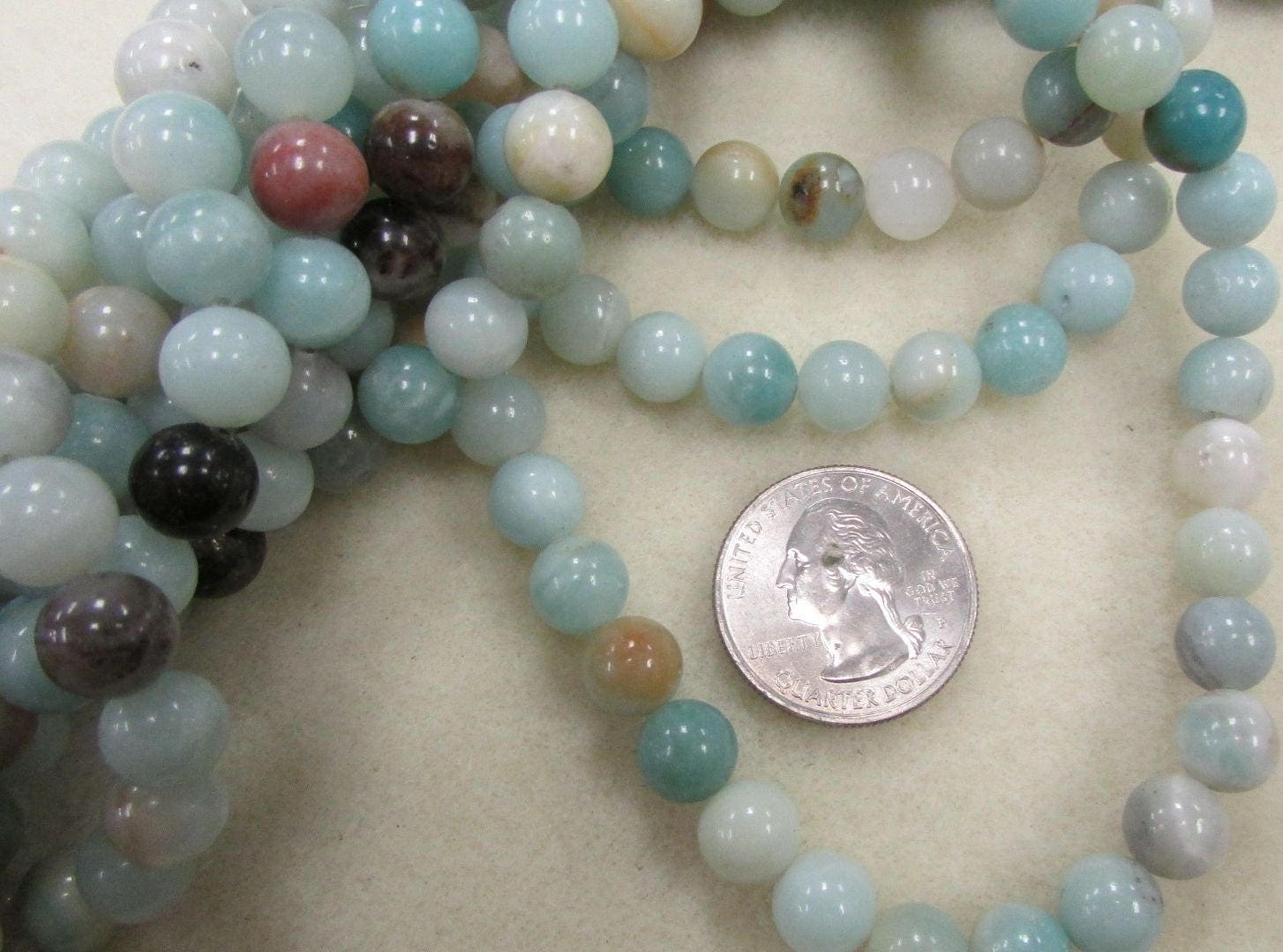 Black Gold Amazonite strand, 8mm smooth polished 16-inch strand