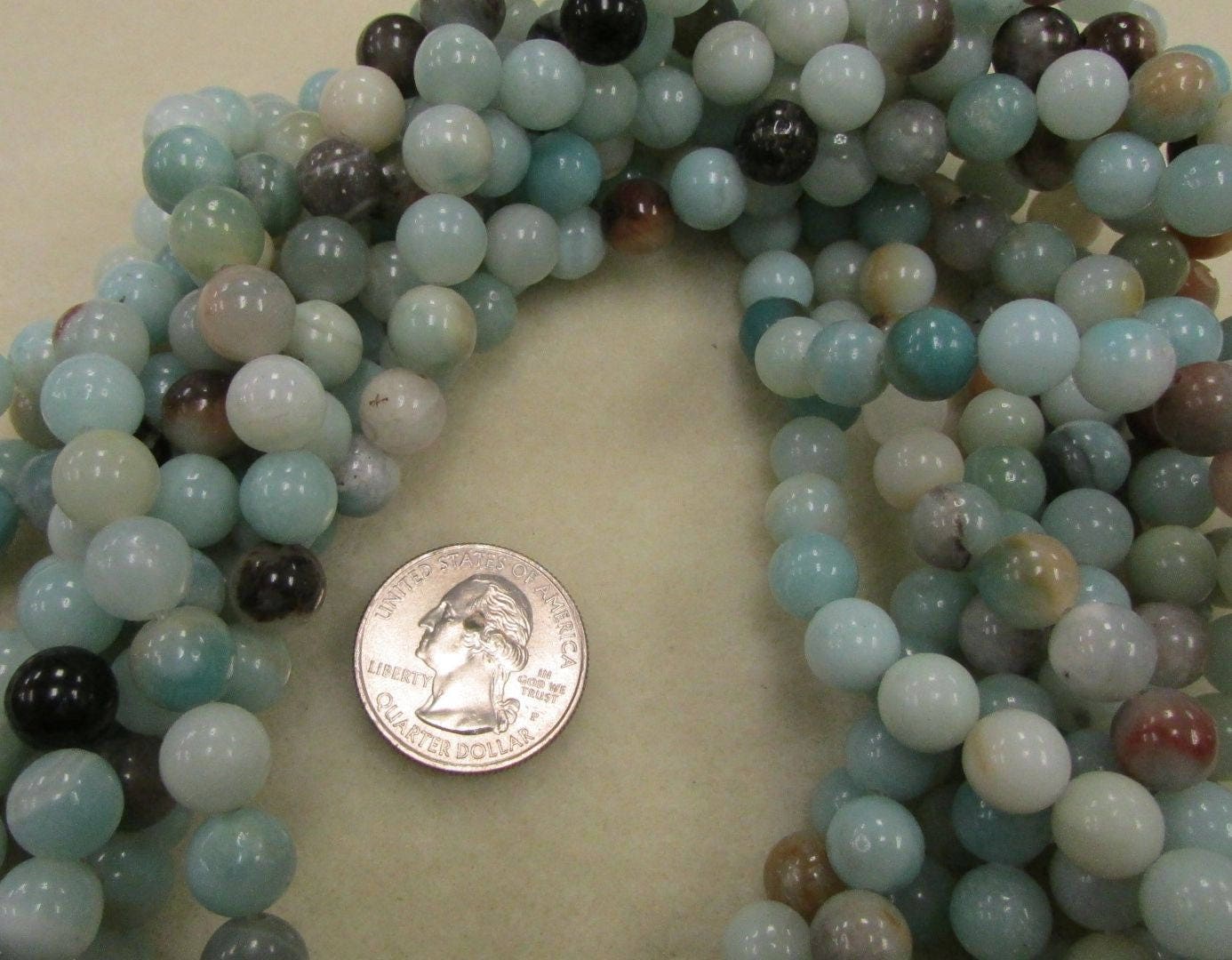 Black Gold Amazonite strand, 8mm smooth polished 16-inch strand